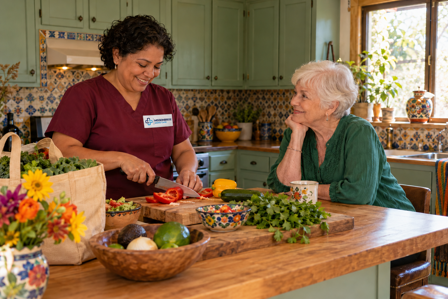 Illustrative helper in branded burgundy scrubs preparing vegetables with an older woman nearby